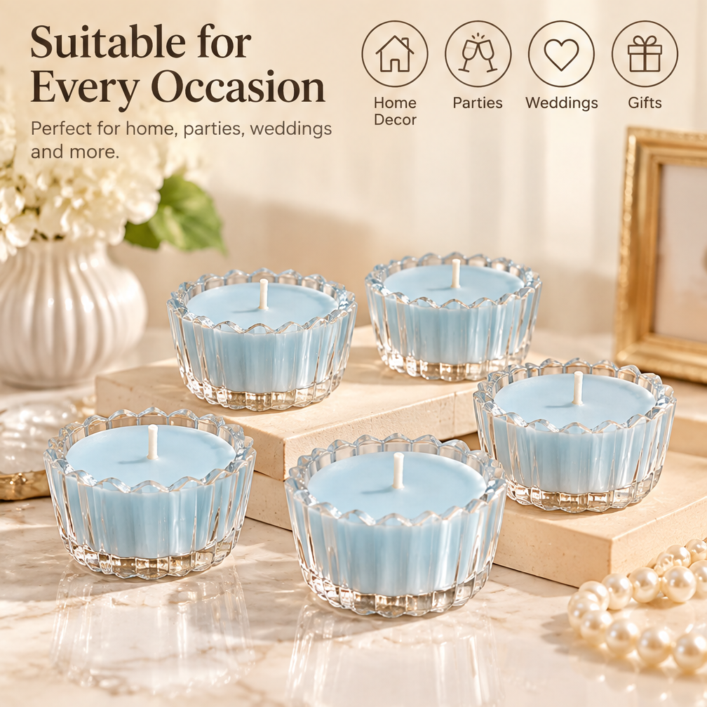 KAELIROAY® Blue Glass Flower Tealight Candle lit in scalloped glass holder on gold bead tray — Create a Warm Atmosphere, Soft candlelight for a calm and cozy space. KAELIROAY gift box with gold lotus logo in background.