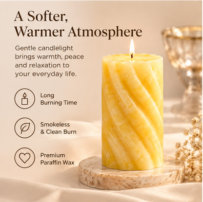 KAELIROAY® Honey Marble Swirl Pillar Candle in warm yellow and ivory spiral design, displayed on marble coaster with dried white flowers and silk fabric — hero product shot