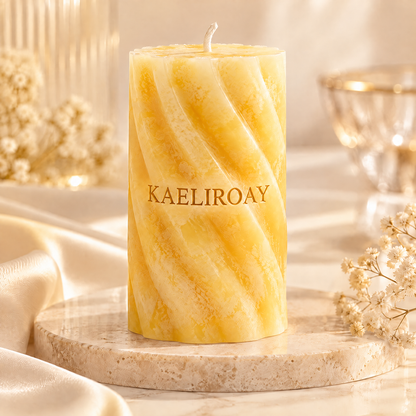 KAELIROAY® Honey Marble Swirl Candle lit in warm glow with crystal glass beside it — A Softer, Warmer Atmosphere. Long Burning Time, Smokeless & Clean Burn, Premium Paraffin Wax. Gentle candlelight brings warmth, peace and relaxation.