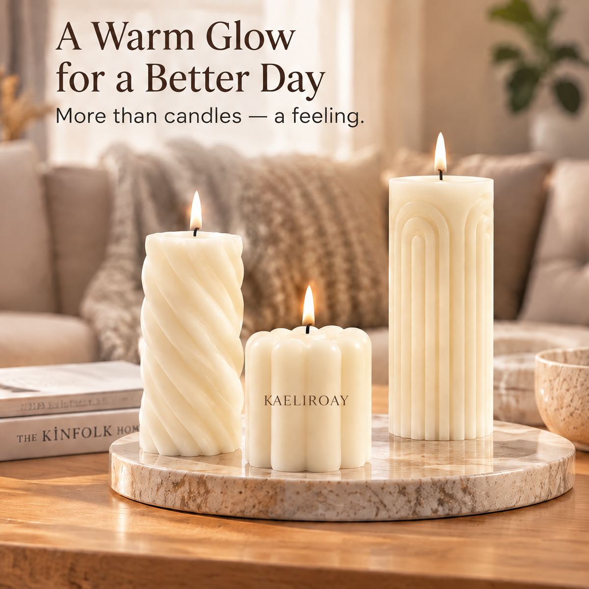 KAELIROAY® Ivory Sculptural Pillar Candle Set — 3 candles lit against cream silk drape on travertine coaster. Spiral (14cm), Petal (8cm) and Arch (18cm) shapes in warm ivory. Hero product shot.
